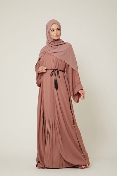 model wearing pink hjiab and modest dress