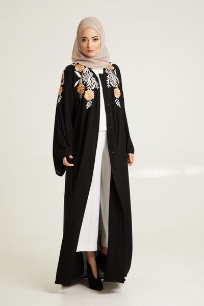 black embroidered abaya with pale hijab
