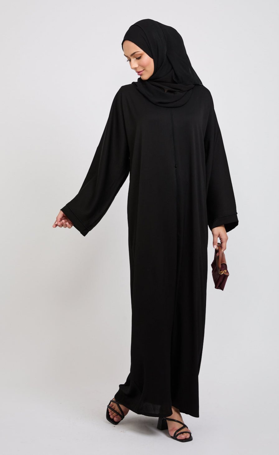 Closed Textured Abaya With Dainty Detailing Black AbayaButh closed-textured-abaya-with-dainty-detailing-black-abayabuth
